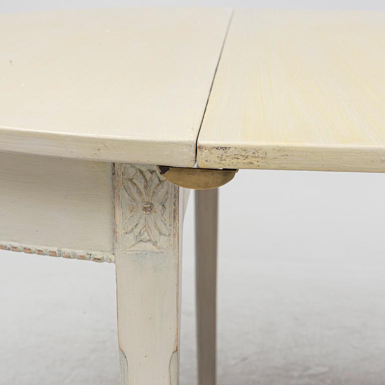A Gustaivan style dining table/ two crescent shaped tables, end of the 19th century.