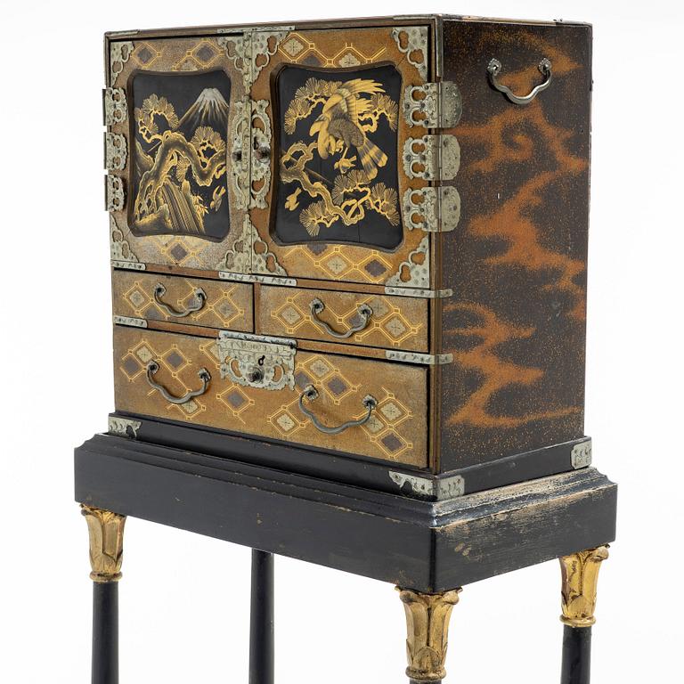 A maki-e cabinet on stand, Japan, 19th century.