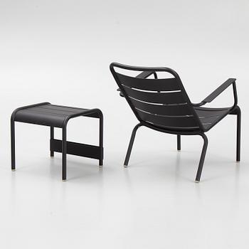 A 'Luxembourg' lounge chair and a foot stool, Fermob.