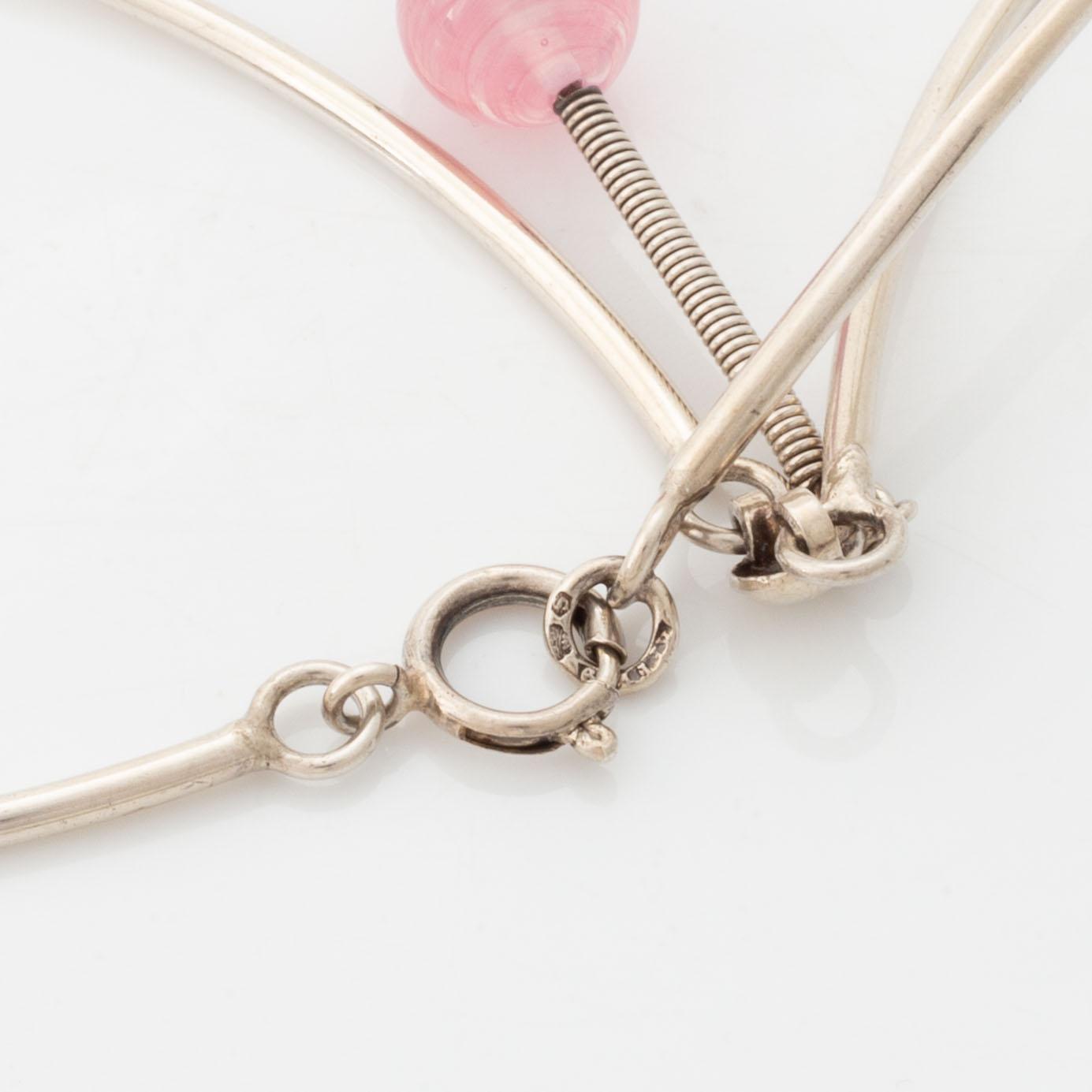 Silver and pink paste necklace.