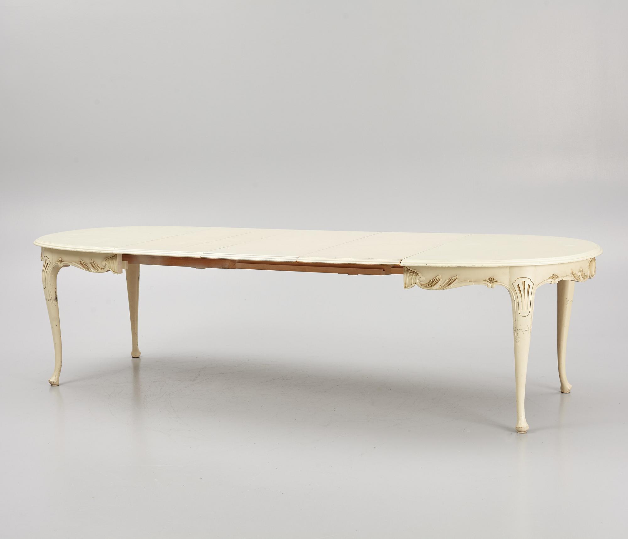A Rococo style Dining Table with Chairs, first half of the 20th Century.