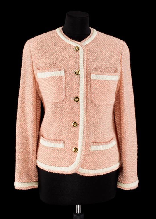 A pink/white bouclé jacket by Chanel.