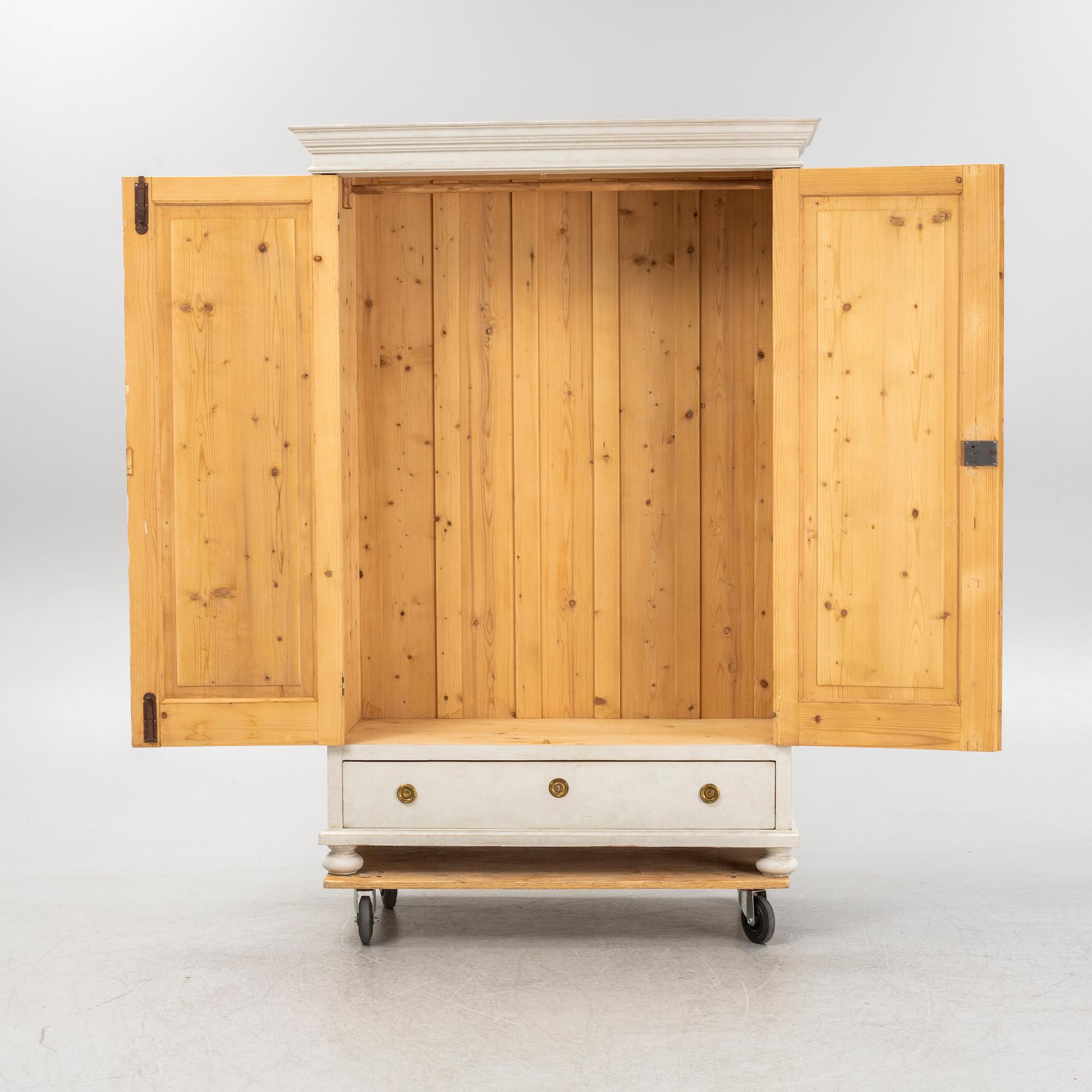 A painted clothes cabinet, 21st Century.