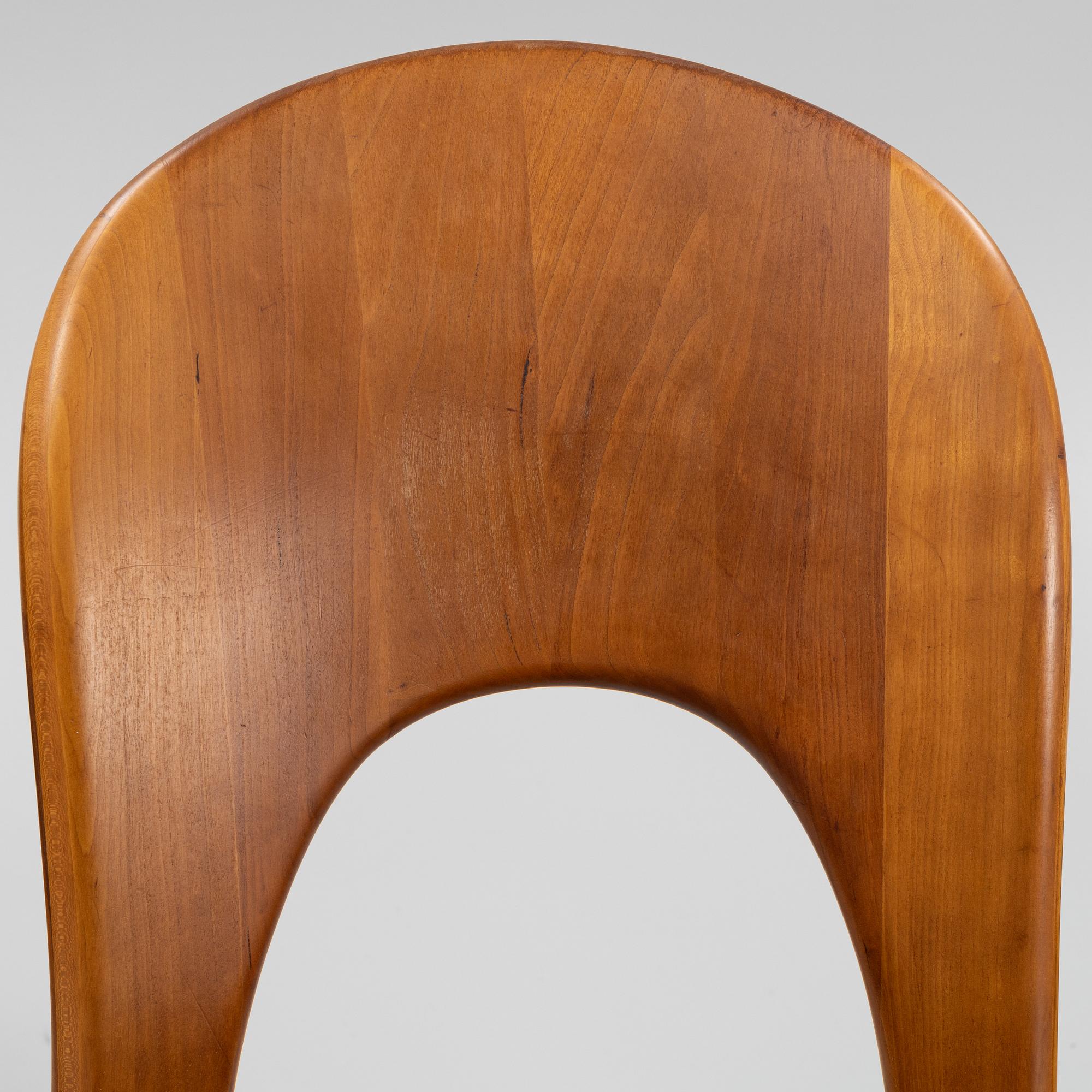 Niels Koefoed, eight teak dining chairs upholstered in new sheep skin, Denmark, 1960's.