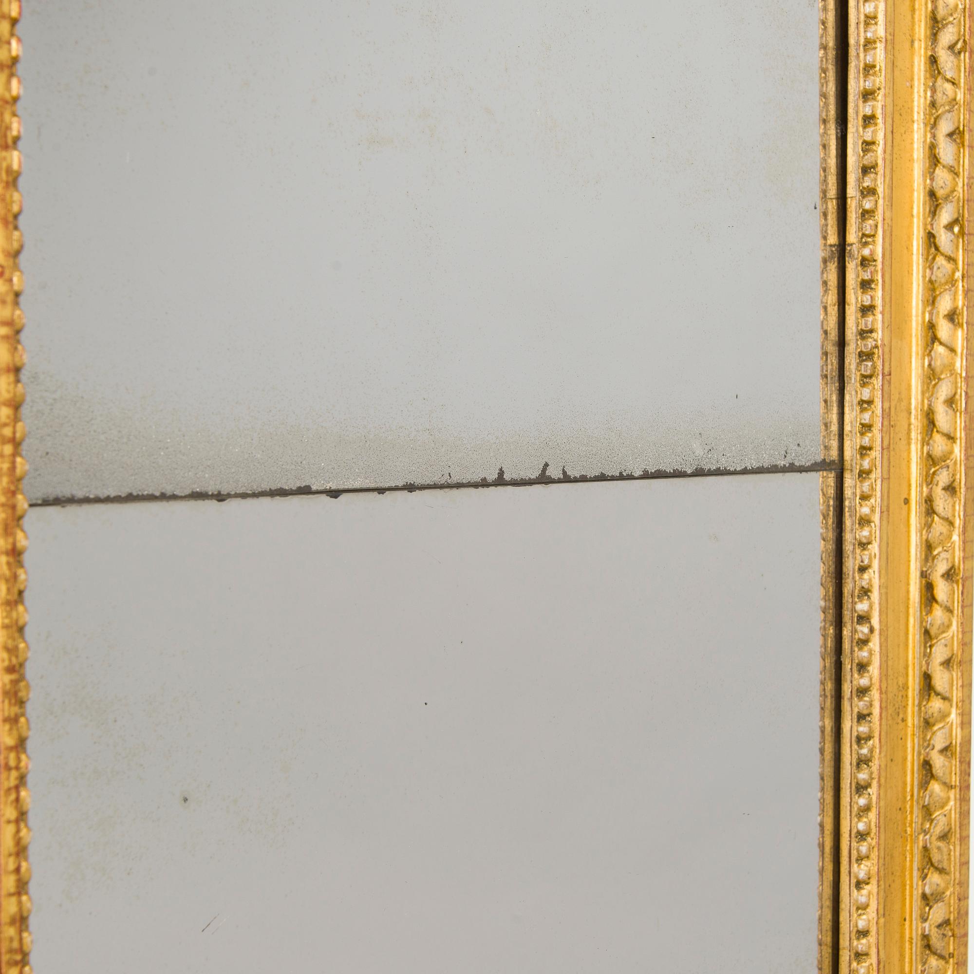 A mirror by Fredric Johan Foeder or Fjäder, (Master in Turku 1782-1832). Signed F.J.F and hallmarked in Turku.