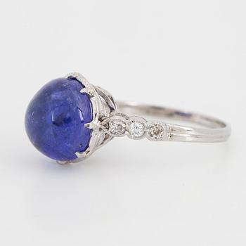 Cabochon-cut tanzanite and brilliant-cut diamond ring.