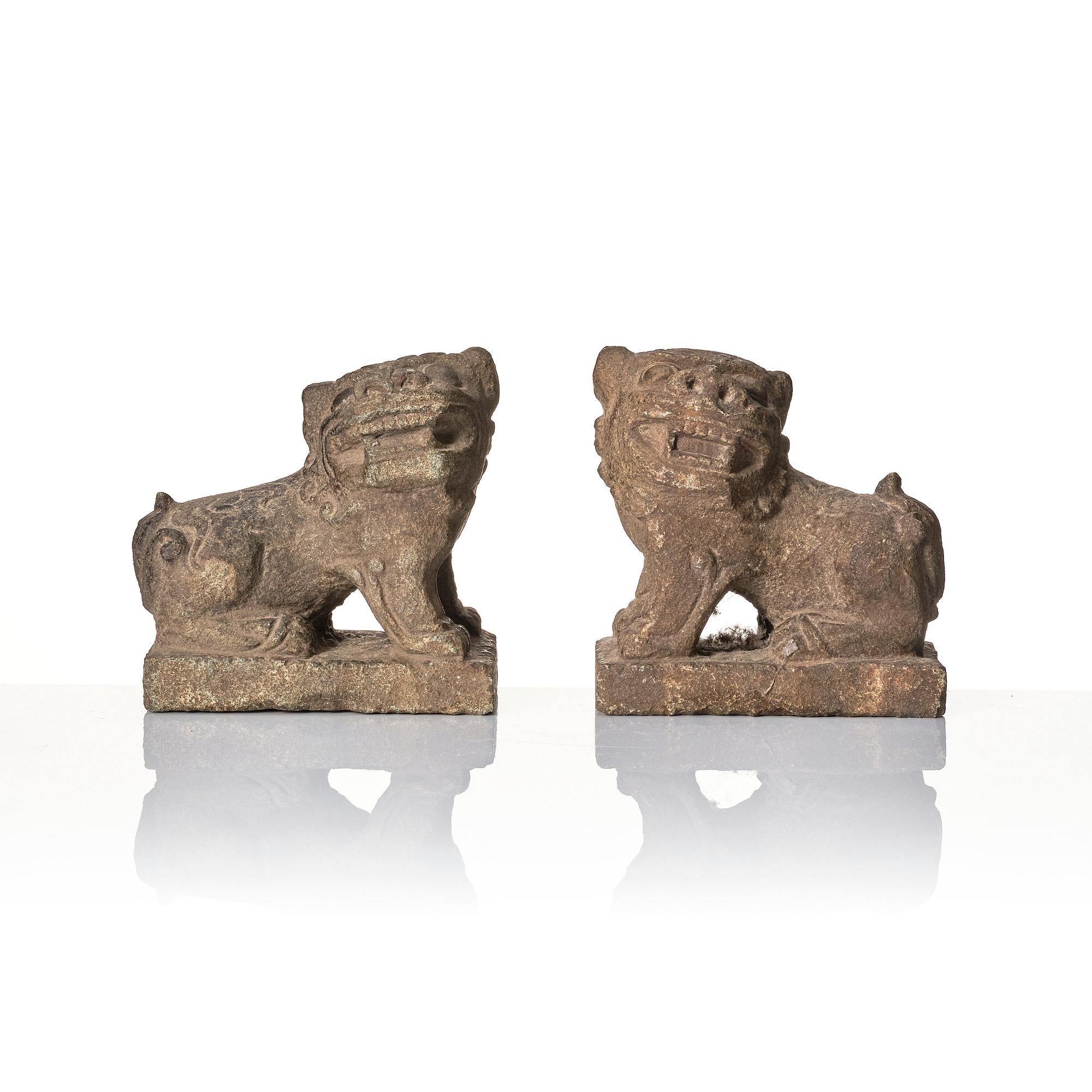 A pair of stone sculptures of buddhist lions, Qing dynasty (1664-1912).