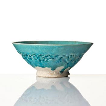 A Kashan Turquoise glazed conical pottery bowl, central Persia, 13th century.