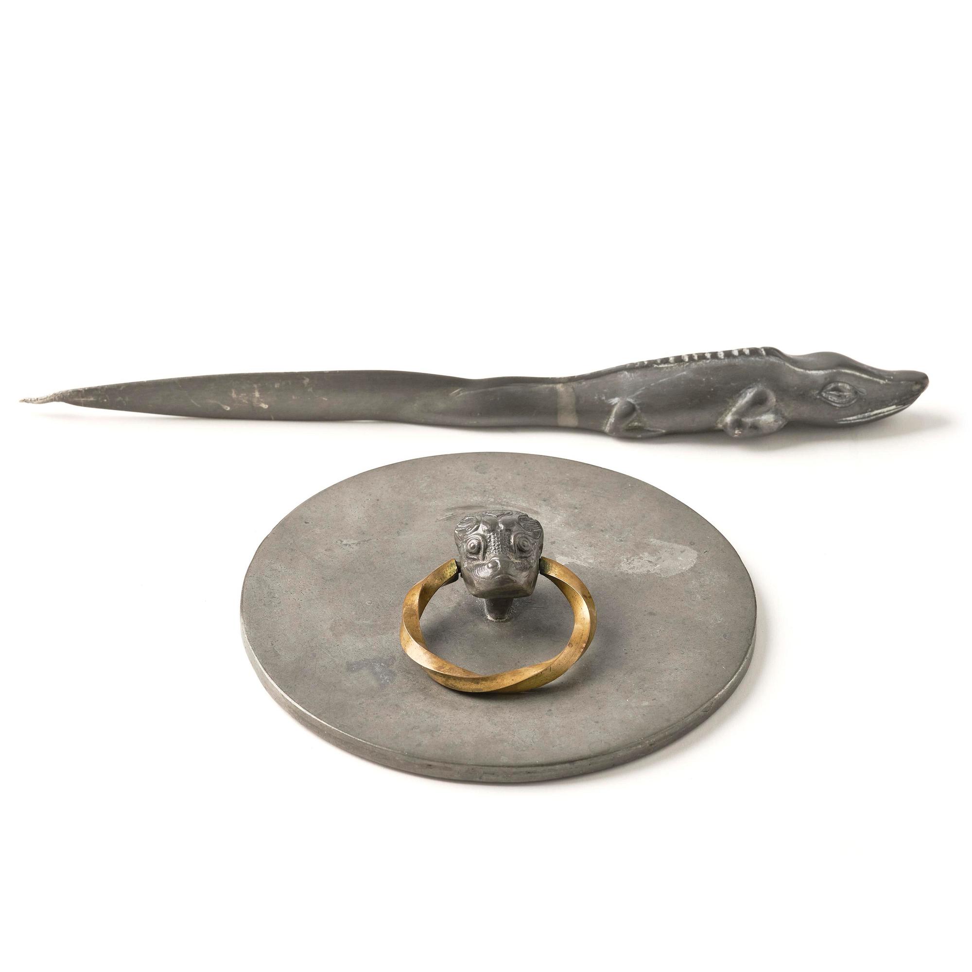 Firma Svenskt Tenn, a pewter hand mirror model A 1497 and a letter opener in the shape of an alligator, Stockholm, 1930s-40s.