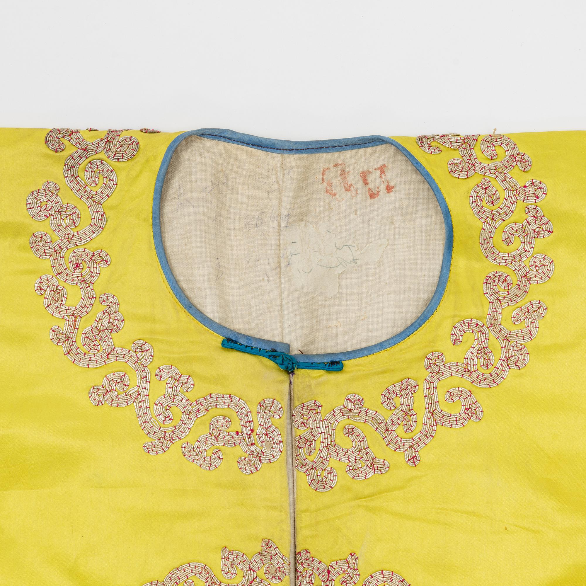 A yellow-ground embroidered silk robe, 20th century.