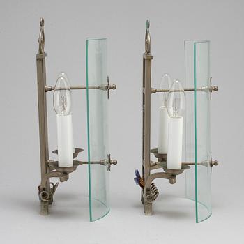 A pair of pewter wall lamps, 1920s.