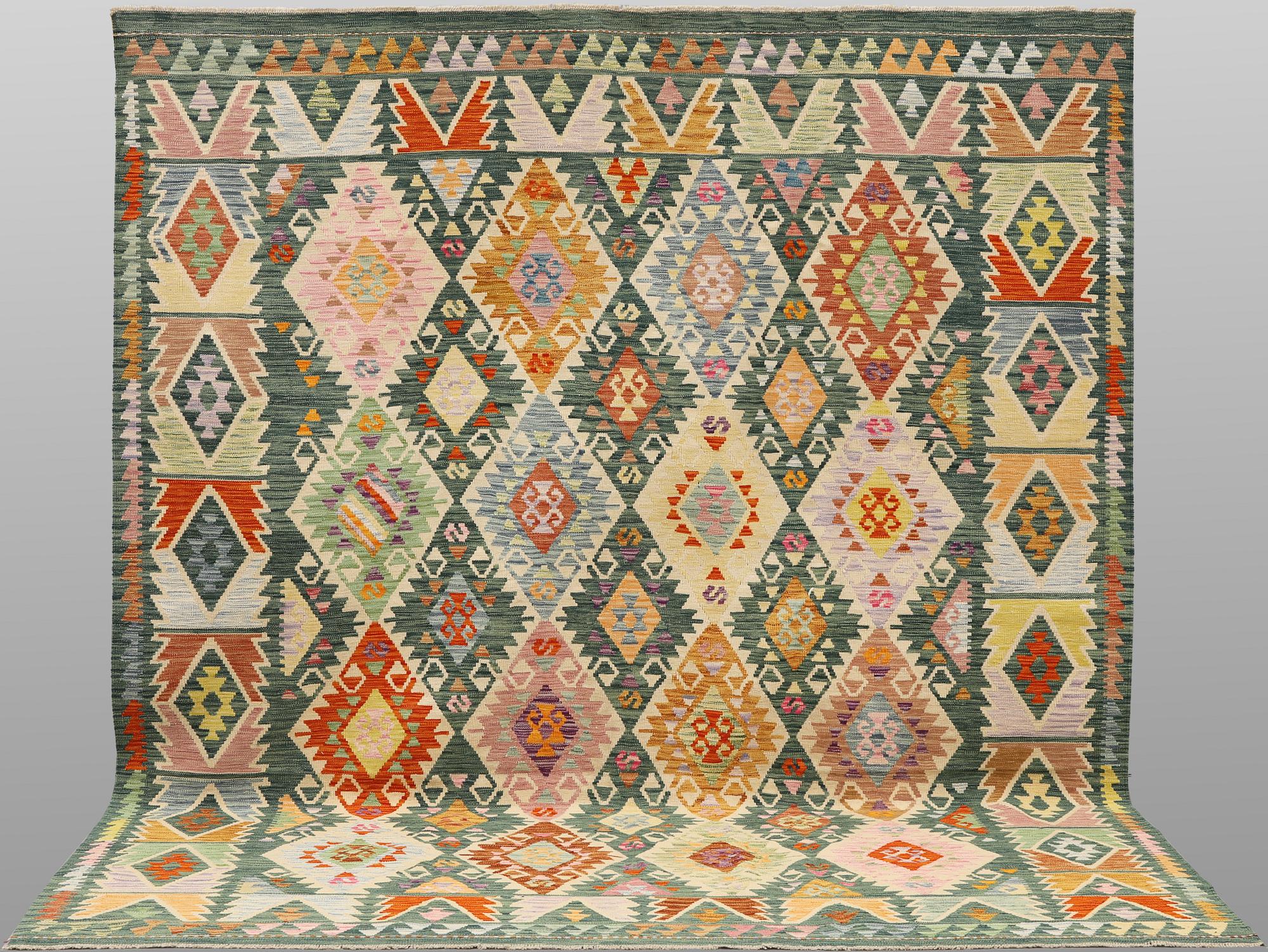 A Kelim carpet, 306 x 257 cm.