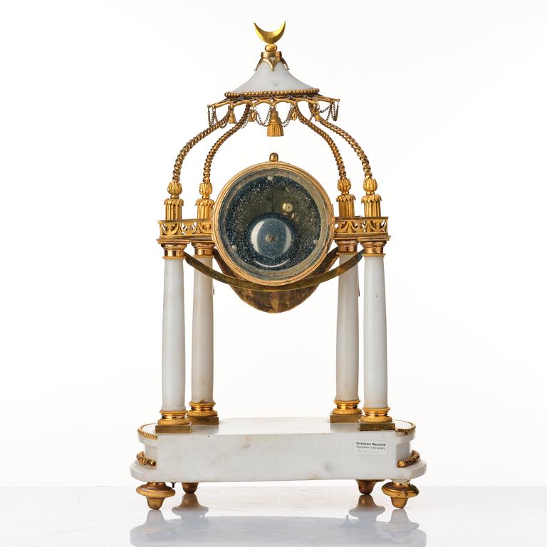 A Louis XVI mantel clock.