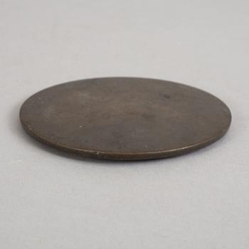 A bronze mirror, Xin-Eastern Han dynasty (9-220).