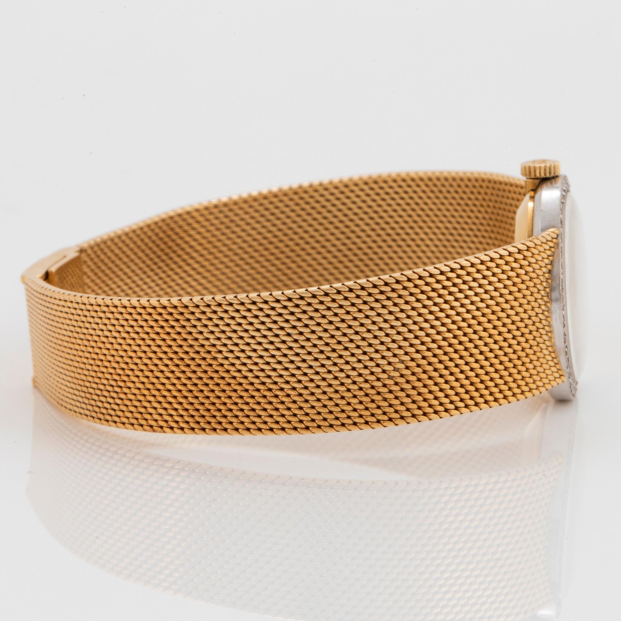 A Chopard wrist watch in 18K gold set with eight-cut diamonds.