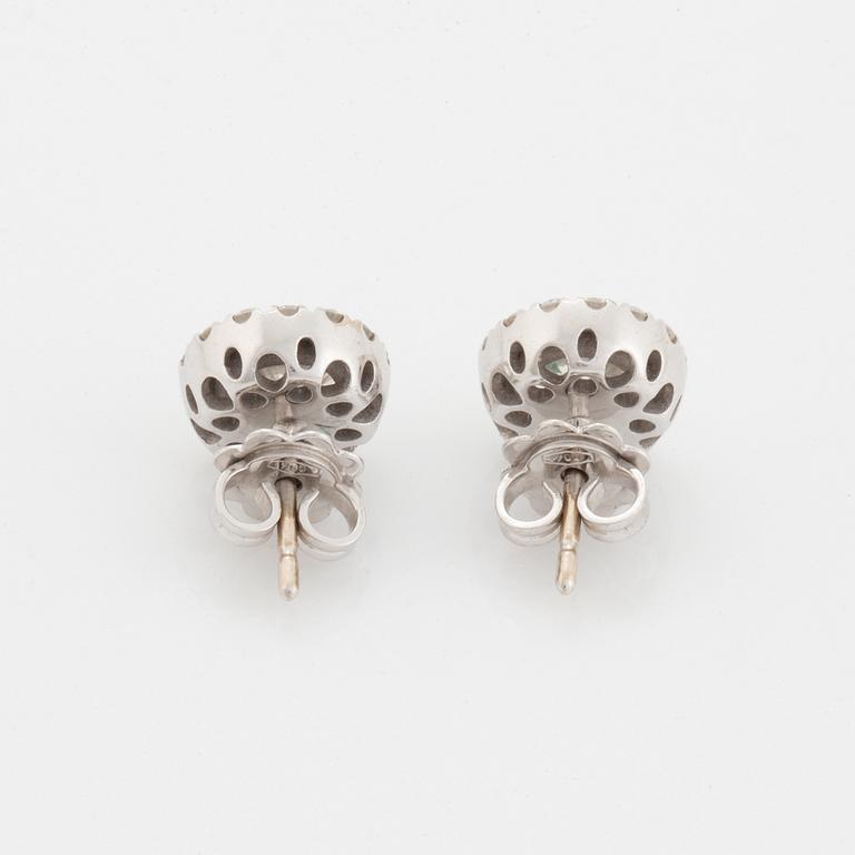 A pair of 18K white gold earrings.
