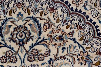 A Nain carpet, c. 310 x 195 cm.