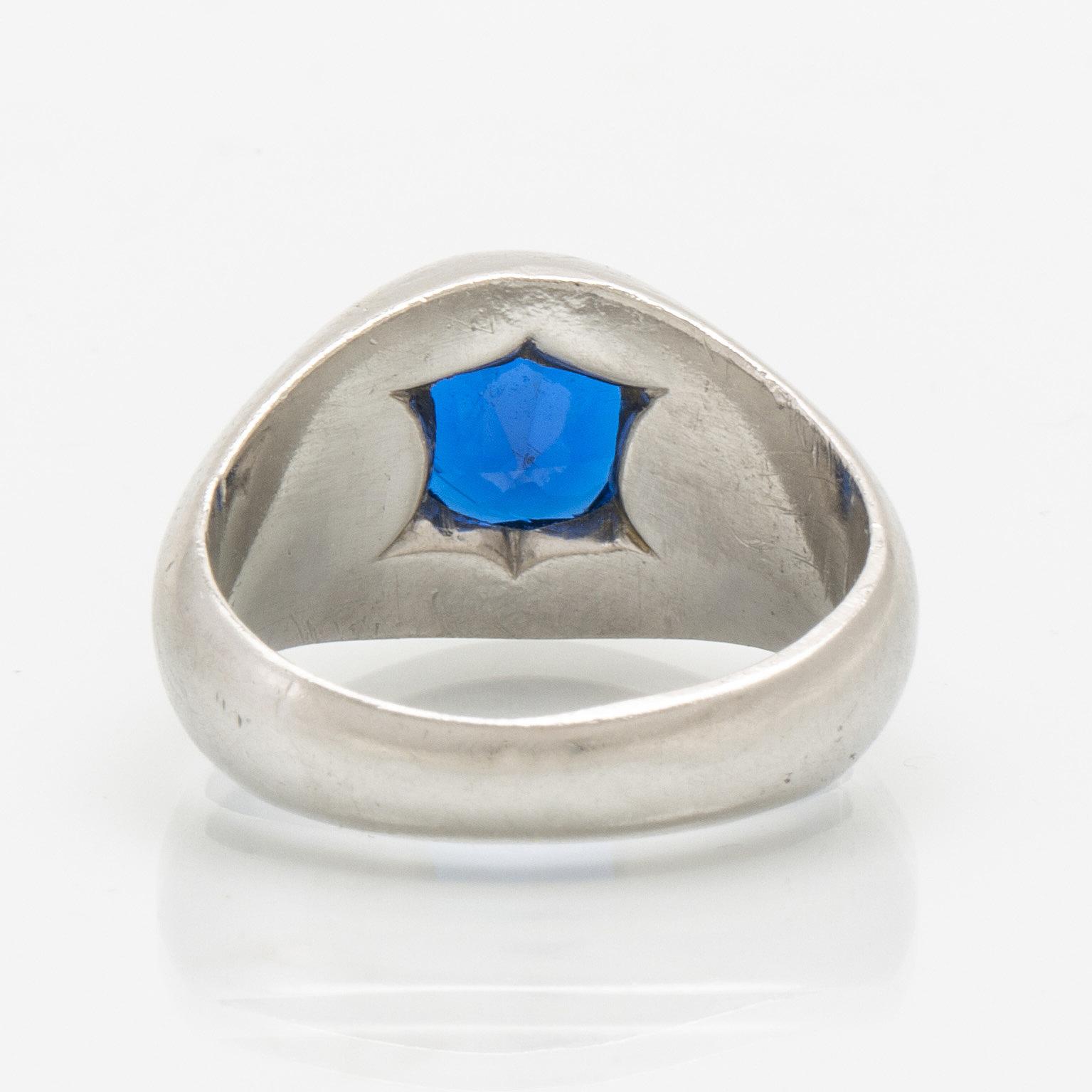 A platinum ring with a synthetic spinel.
