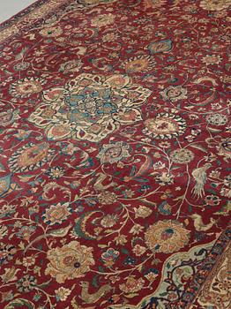 A CARPET, A semi-antique Esfahan part silk, ca 350,5 x 233,5 cm.