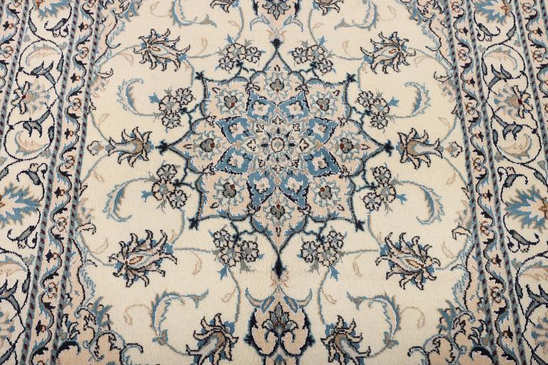 A Nain part silk rug, c. 193 x 148 cm.