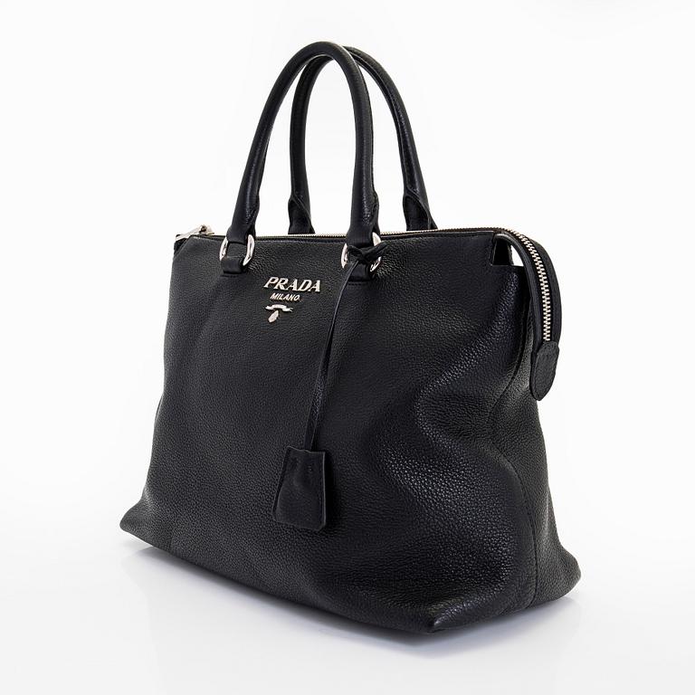 Prada, a leather bag.