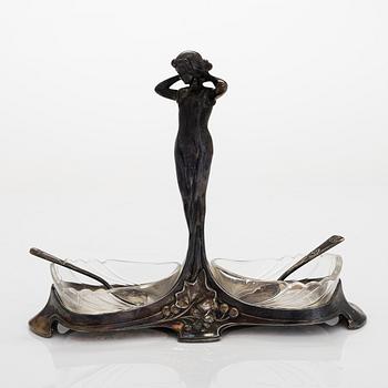 A salt cellar, paper knife, dish, and 12 butter knife stands, Art Nouveau, early 20th century. Two marked WMF.