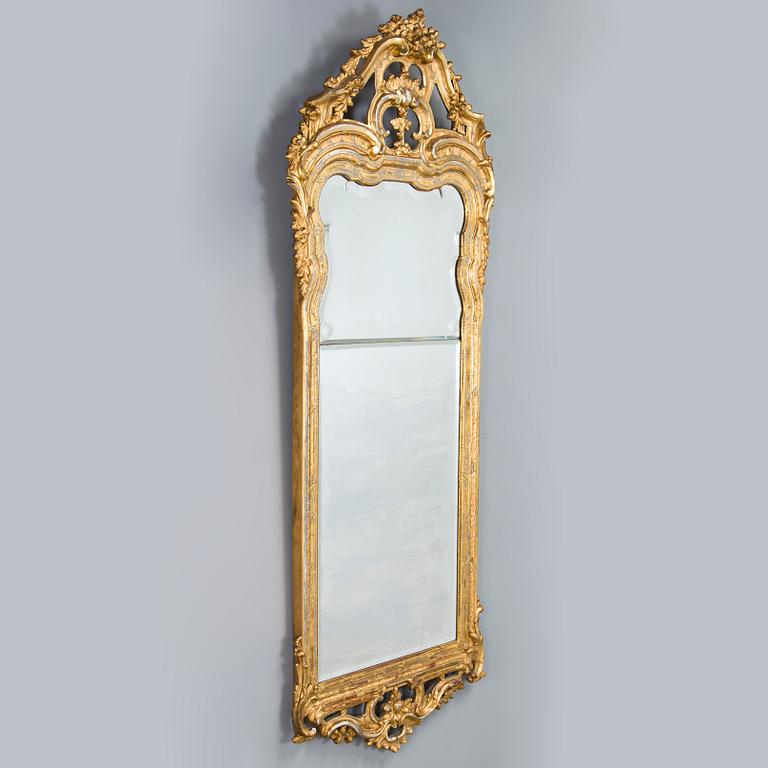 Johan Åkerblad, a giltwood Rococo mirror, signed and dated in Stockholm 1776.