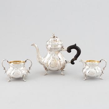 An early 20th century Rococo-style parcel gilt and silver three part coffee service.
