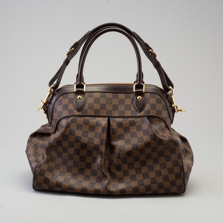 a LOUIS VUITTON 'Trevi GM' bag.