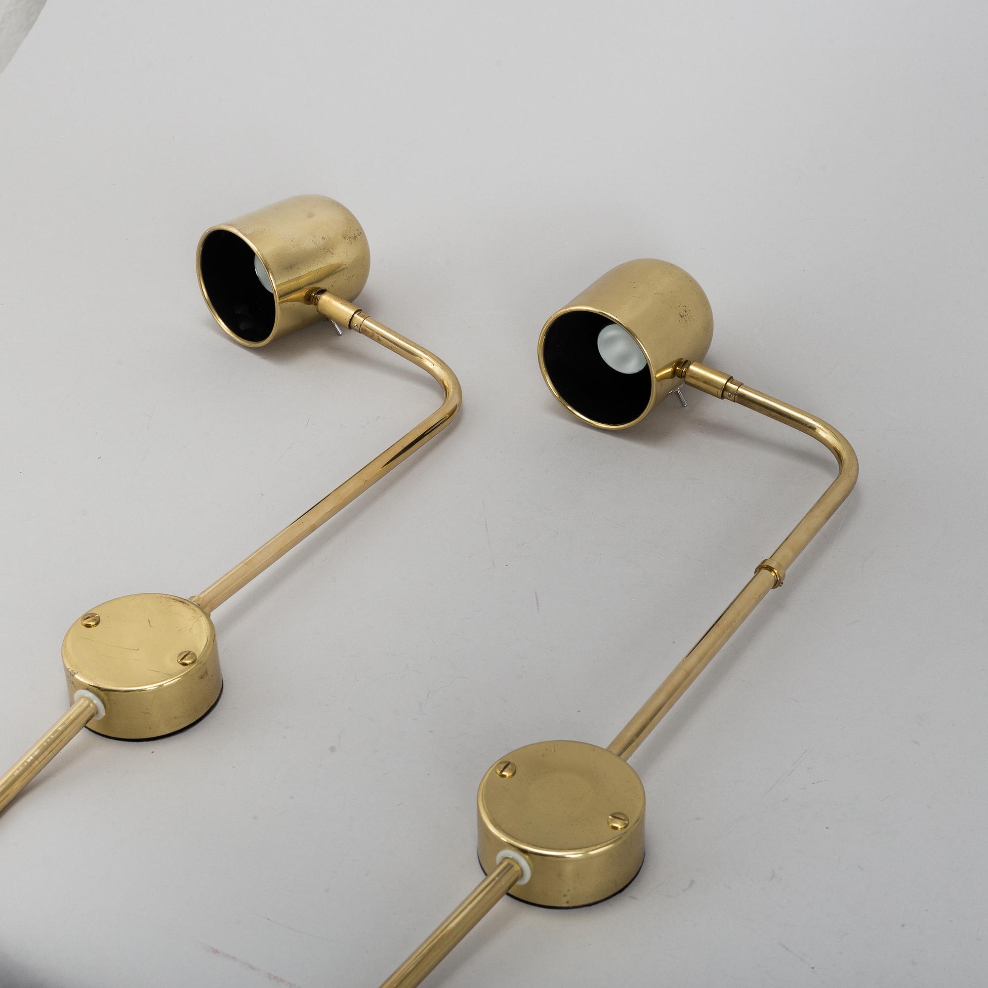 A pair of brass wall lights by Bergboms.