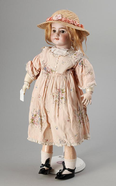 A German/French bisquit doll, around 1900. Marked DEP.