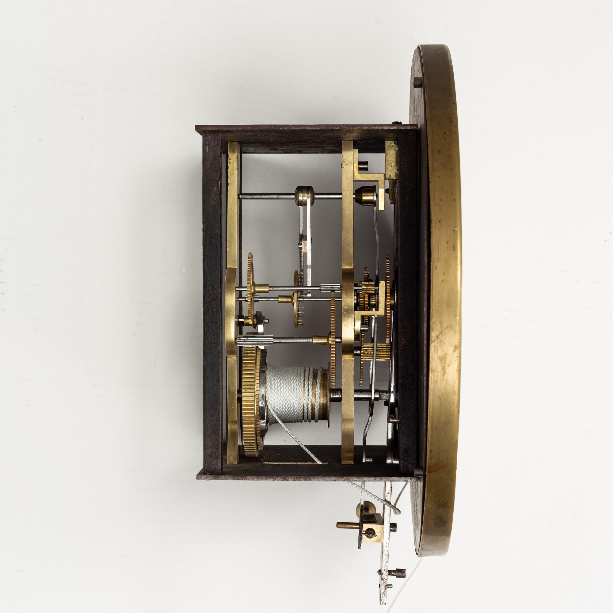 A walnut long case clock, from around the year 1900.