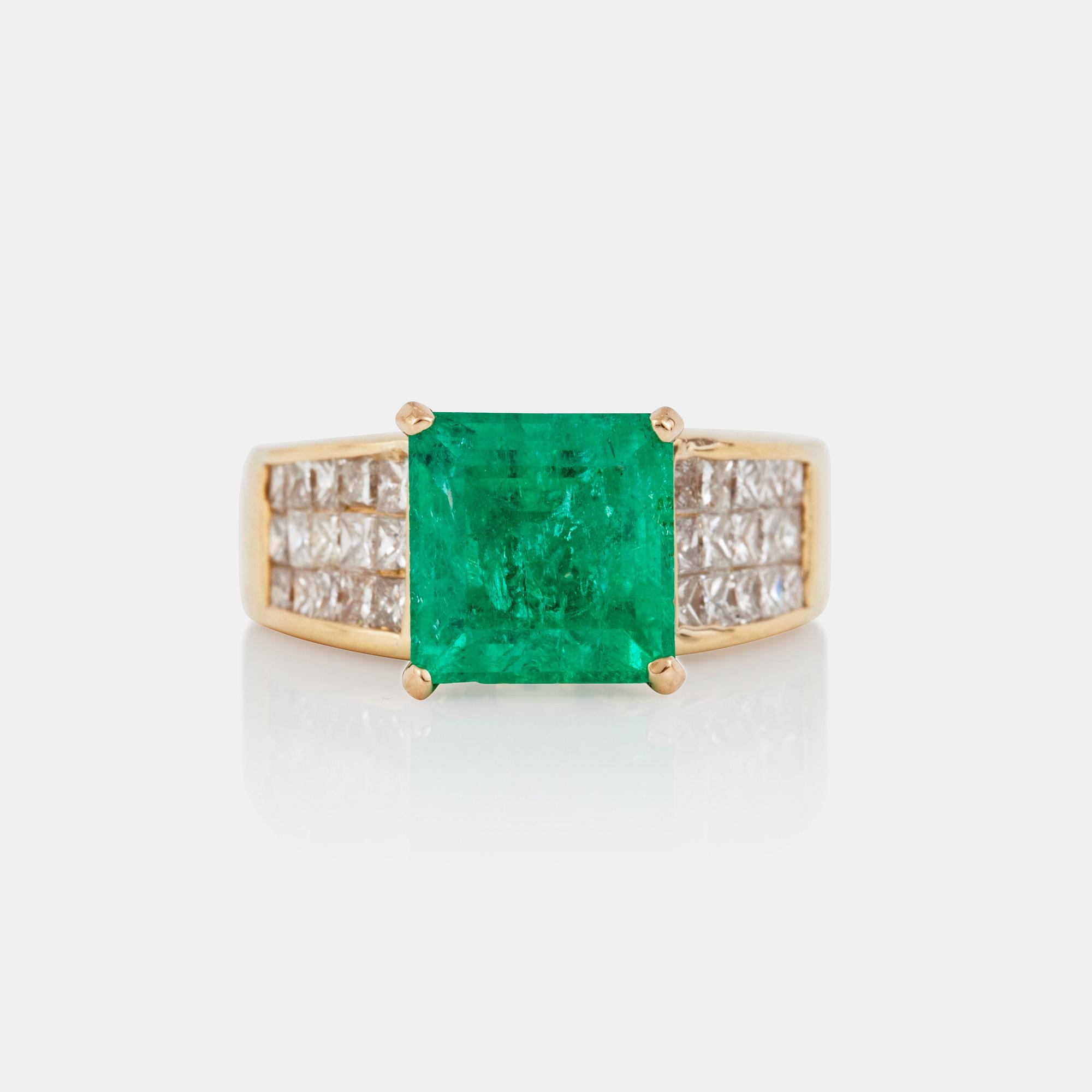An emerald, circa 3.5 cts, and diamond, circa 1.95 cts, ring.
