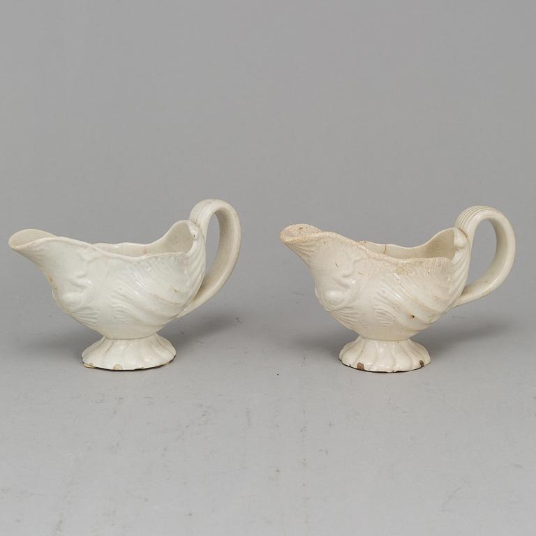A creame weare buttertureen with cover, a cake mould and a pair of sauce boats, 18/19th Century, part Rörstrand.