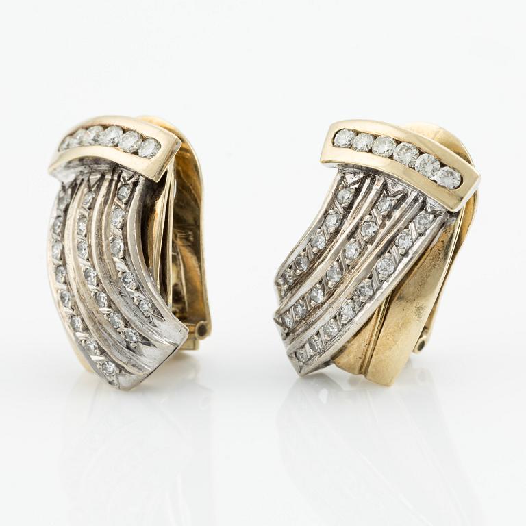 Gold earrings with brilliant-cut and octagon-cut diamonds.