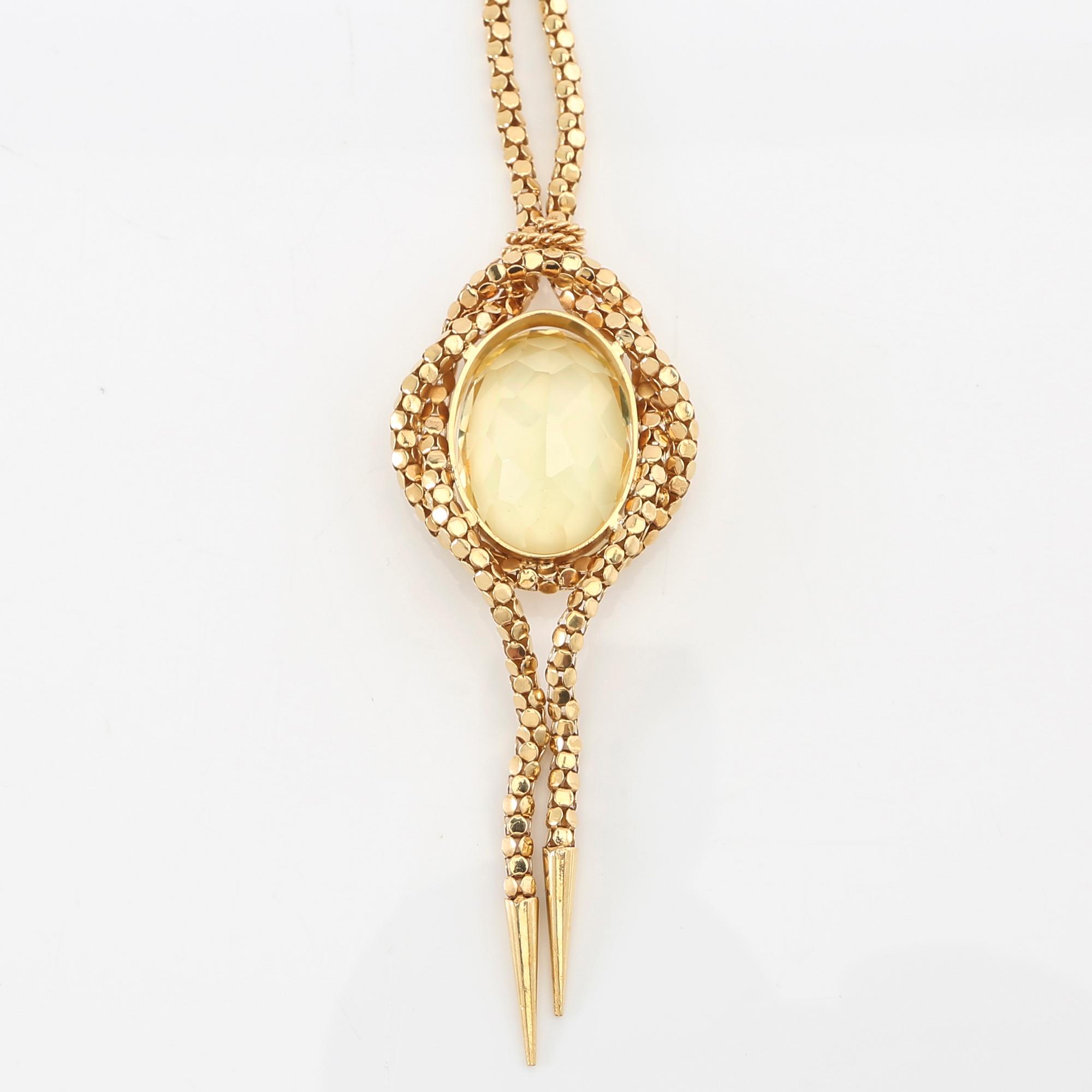 Necklace 18K gold with an oval faceted green synthetic spinel.