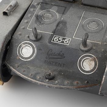 Three tin toys including a Gescha tank, Germany, mid 20th century.