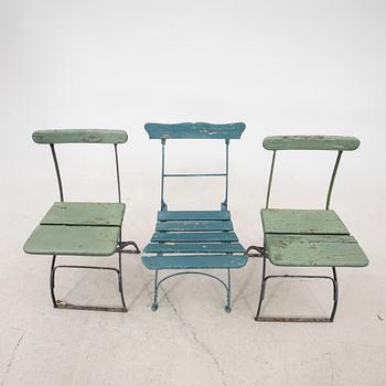 A set of three garden chairs and one cast iron and marble table first half of the 20th century.