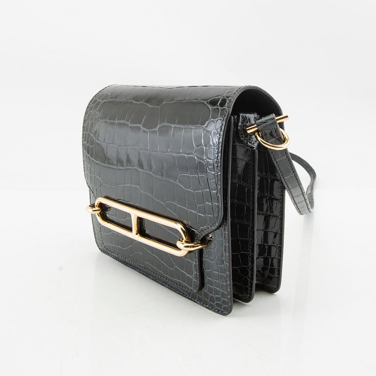 Hermès, bag "Green Shiny Alligator Mini Roulis 18 Permabrass Hardware" 2021.