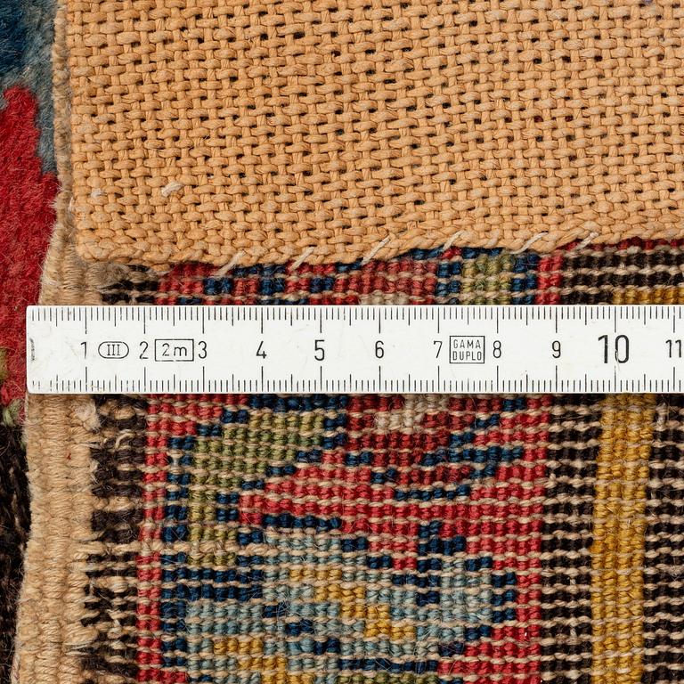 An antique Karabagh carpet,  ca 330 x 157 cm (one end with 1-3 cm flat weave).