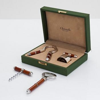 A French four-piece Christofle bottle opener and stopper set, of which two in original box.