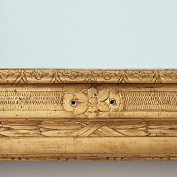 A Gustavian giltwood frame with mirror glass, late 18th century.