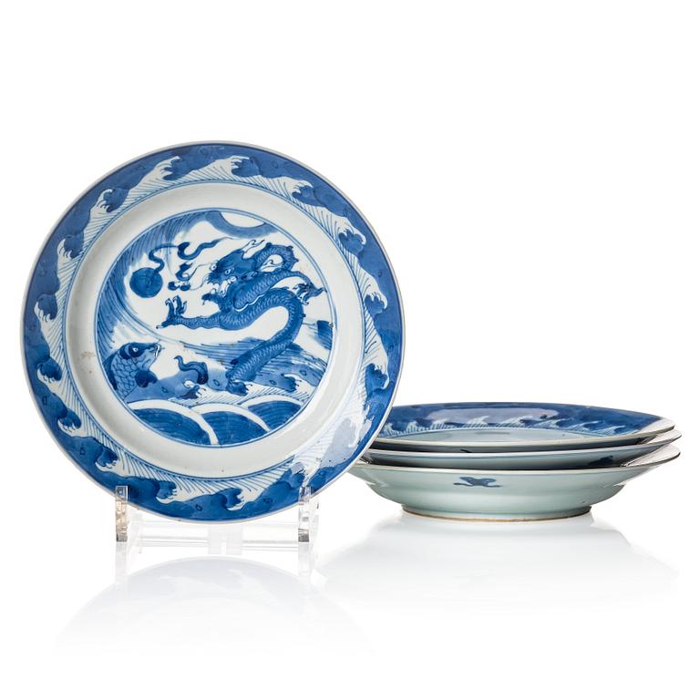 A set of four blue and white dinner plates, Qing dynasty, Kangxi (1662-1722).