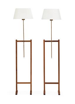 74. A pair of Josef Frank walnut floor lamps, Svenskt Tenn, model 2548.