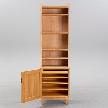 An oak book case with a cabinet, second half of the 20th Century.