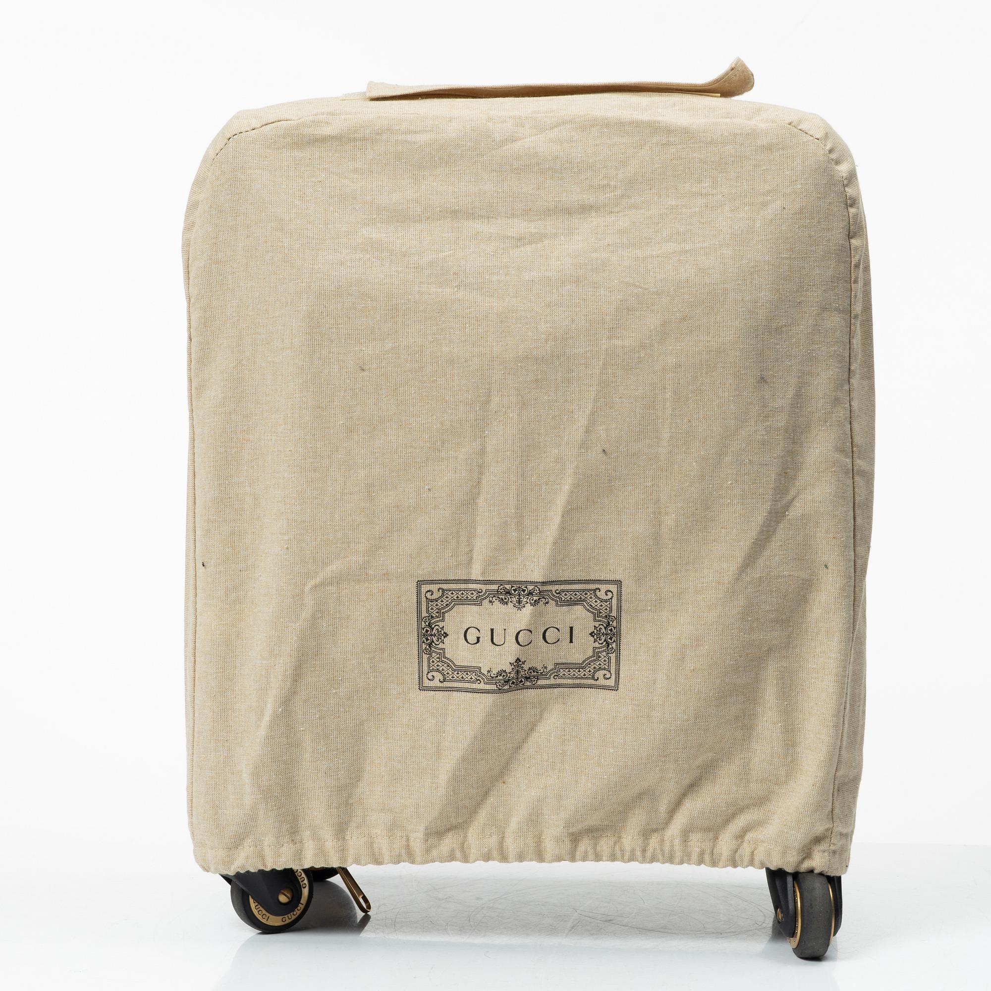 Gucci, suitcase / cabin bag.