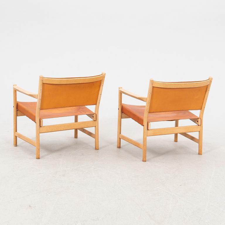 Alf Svensson, a pair of oak and leather armchairs from the second half of the 20th century.