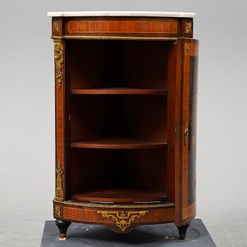 A 19th century corner cabinet.