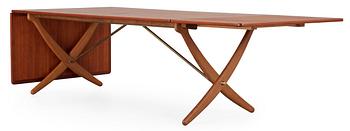 456. A Hans J Wegner teak and oak sabre leg dinner table by Andreas Tuck, Denmark 1950-60's.