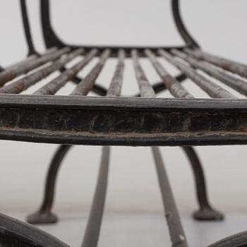 GARDEN SOFAS, a pair, cast iron, empire style, late 19th century.